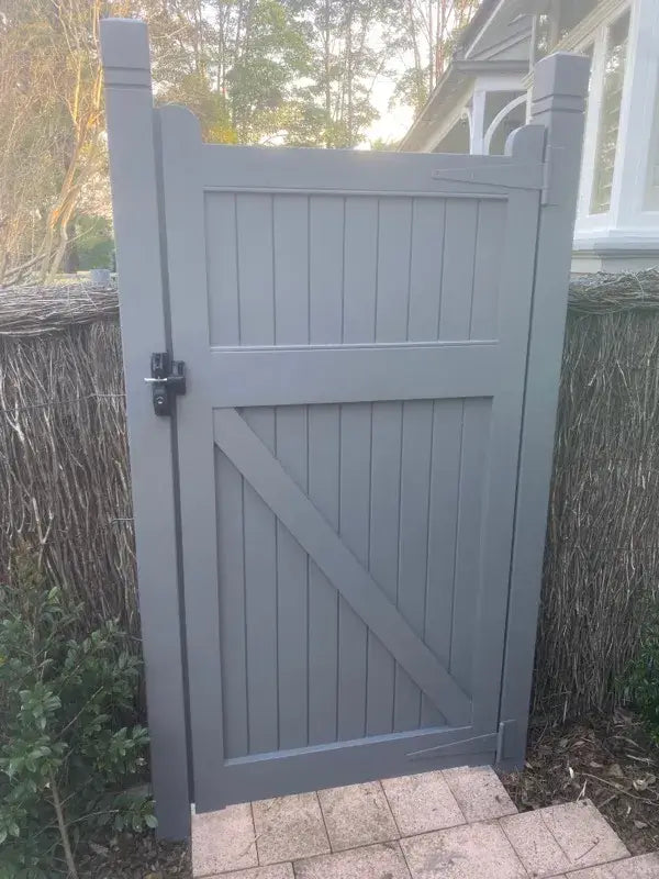 Solid timber pedestrian gate with privacy window and curved top rail