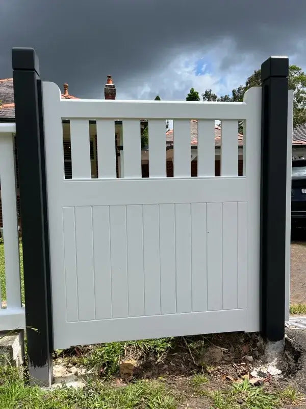 Timber pedestrian gate with evenly spaced picket window, primed