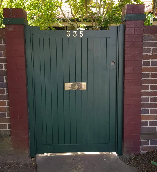 Collaroy Solid timber gate with flush face and brass mail slot detail